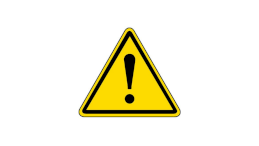 Żółty znak drogowy w kształcie trójkąta z czarnym wykrzyknikiem